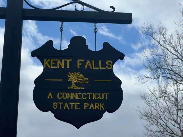 a sign board with a lake view