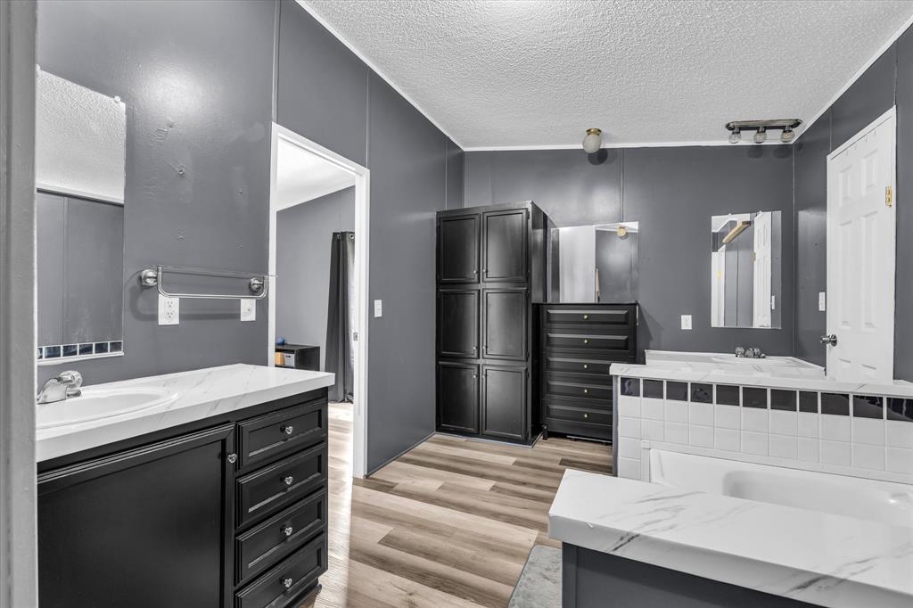 3615 Spring Valley Road Lorena, TX 76655 - Photo 23 of 33 Dual vanity sinks with white countertops and integrated sinks