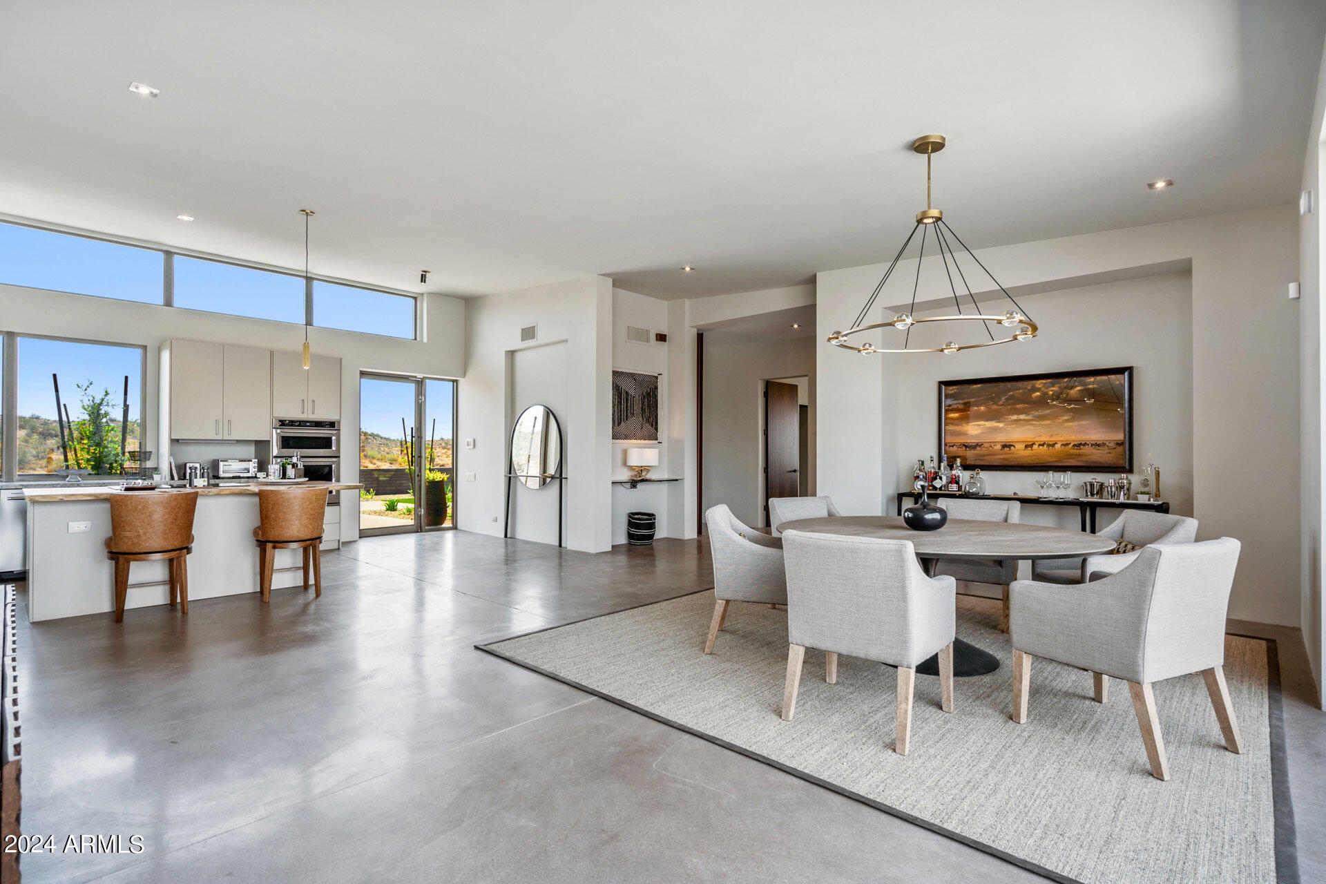 15322 North Sandy Blf Road Fort McDowell, AZ 85264 - Photo 14 of 65 a living room with furniture a dining table and a chandelier