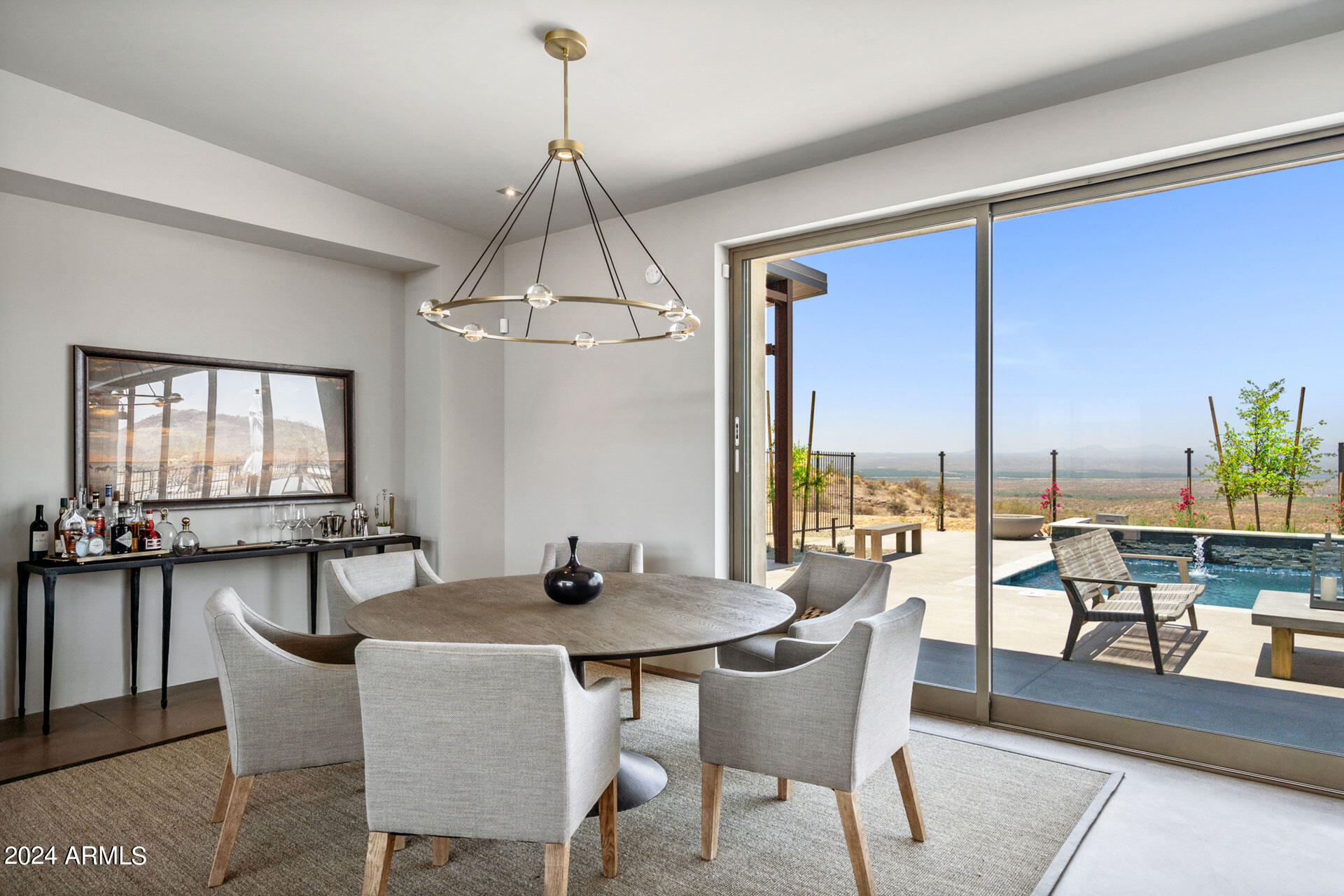 15322 North Sandy Blf Road Fort McDowell, AZ 85264 - Photo 15 of 65 a dining room with furniture a chandelier and wooden floor