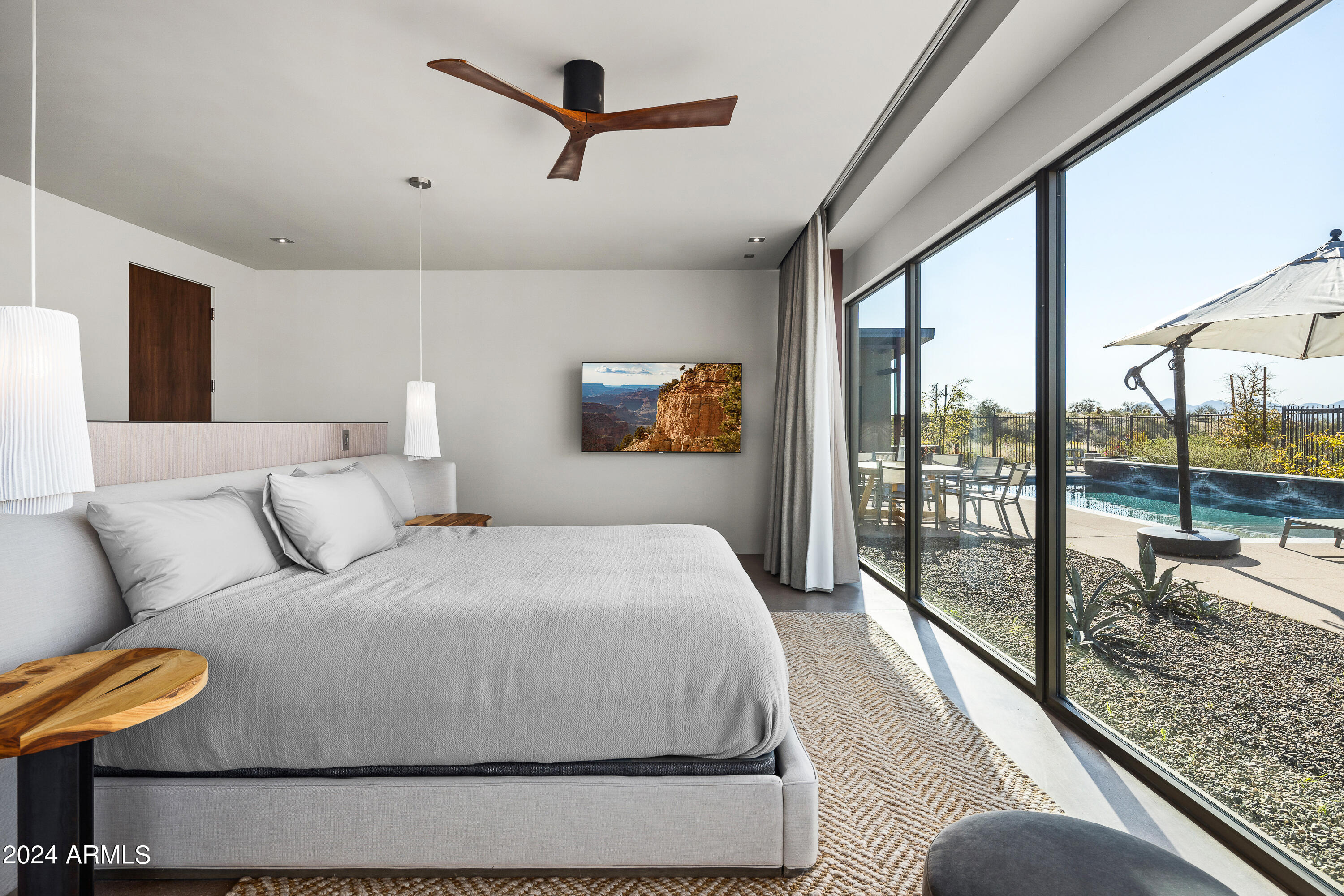 15322 North Sandy Blf Road Fort McDowell, AZ 85264 - Photo 17 of 65 a bedroom with a large bed and a balcony view