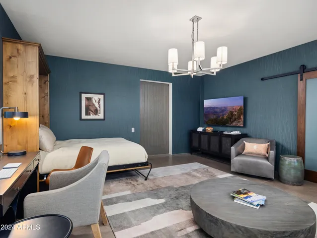 a bathroom with a sink a mirror a vanity and a shower