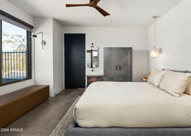 a view of swimming pool with outdoor seating and a patio