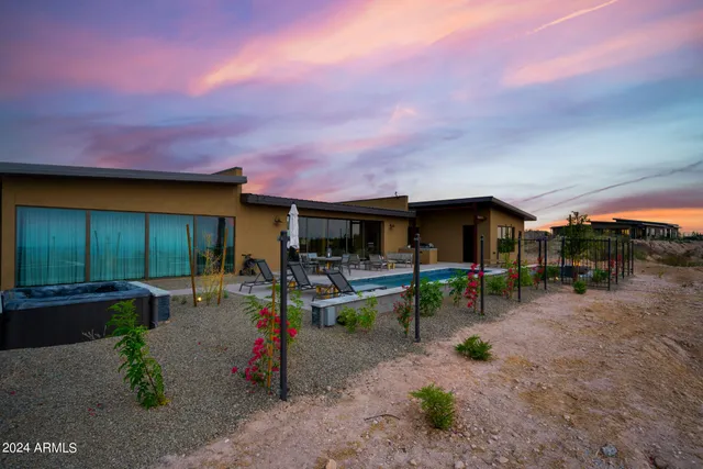 a view of an outdoor kitchen and swimming pool