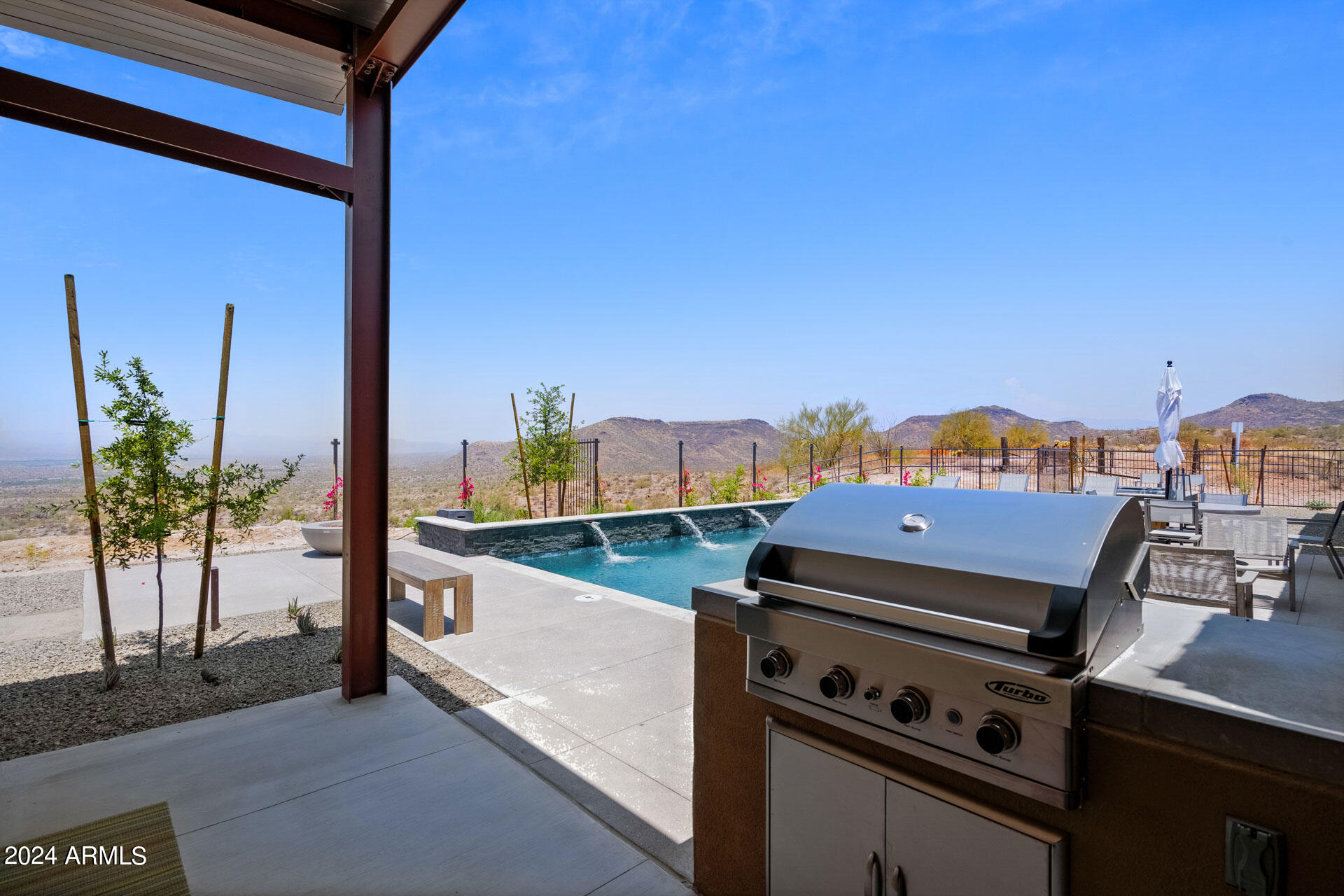 15322 North Sandy Blf Road Fort McDowell, AZ 85264 - Photo 48 of 65 a kitchen with stainless steel appliances a stove and a potted plant