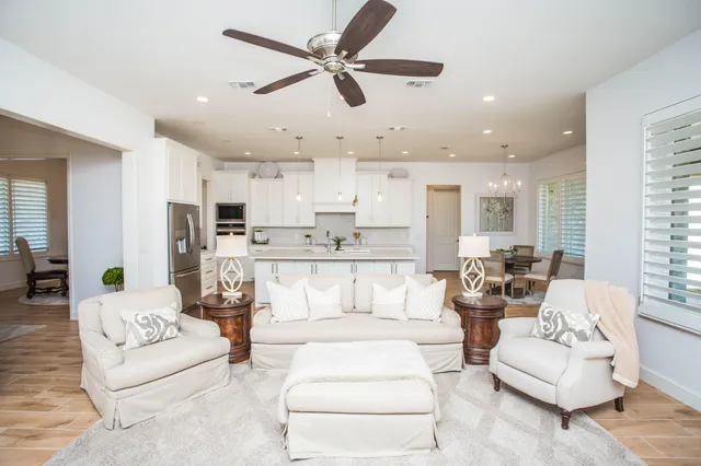 a living room with furniture white walls and white walls