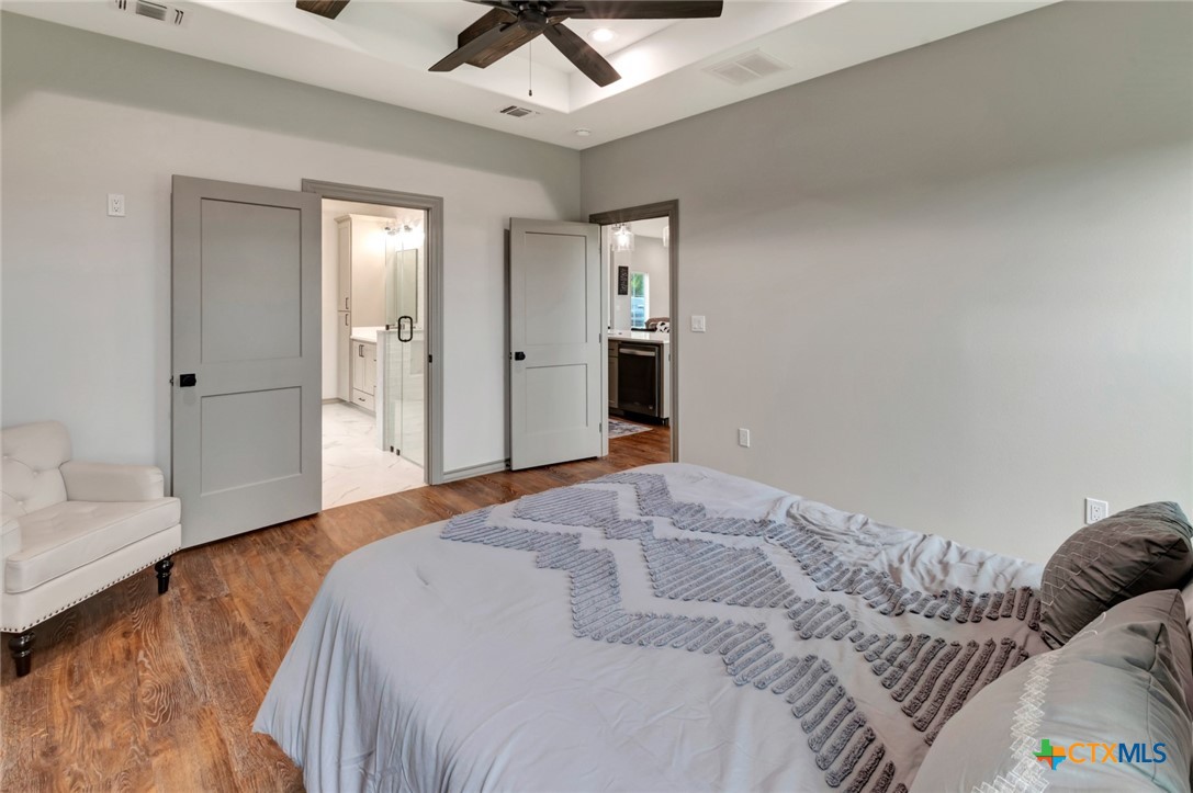 305 Turkey Lane Victoria, TX 77905 - Photo 14 of 35 a bedroom with a bed and a couch