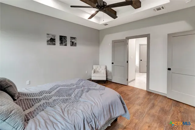 a bedroom with a bed and window