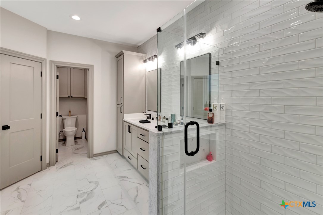 305 Turkey Lane Victoria, TX 77905 - Photo 16 of 35 a bathroom with a double sink shower and a mirror