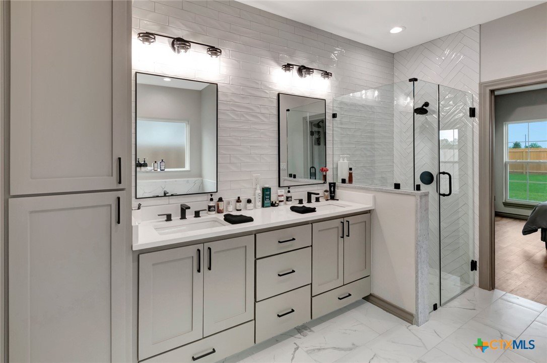 305 Turkey Lane Victoria, TX 77905 - Photo 19 of 35 a bathroom with a double vanity sink mirror and double