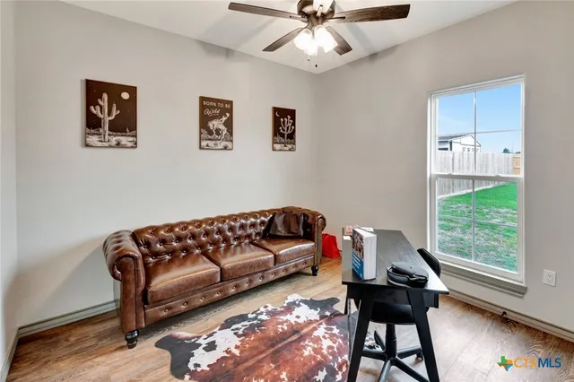 a living room with furniture and a window