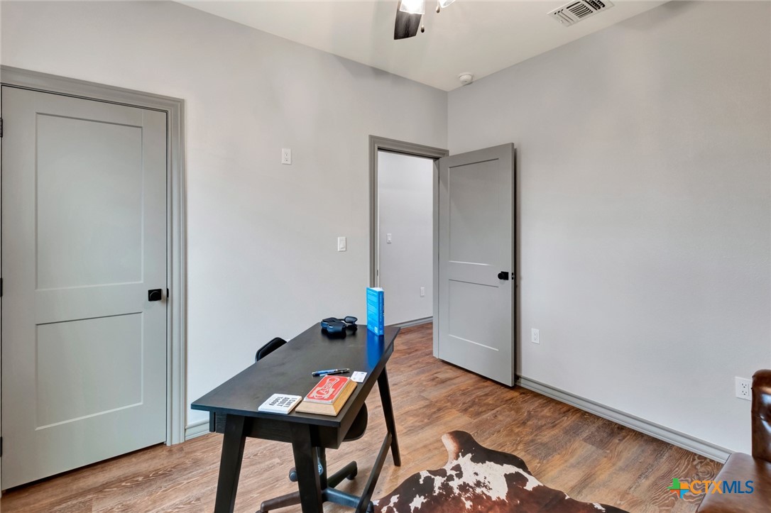 305 Turkey Lane Victoria, TX 77905 - Photo 23 of 35 a room with furniture and wooden floor
