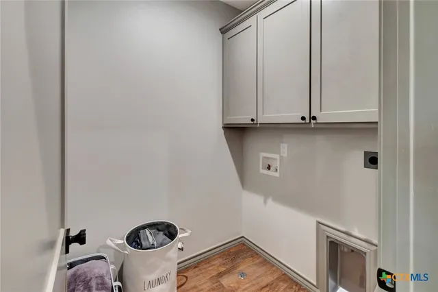 a view of storage and utility room with racks on the wall