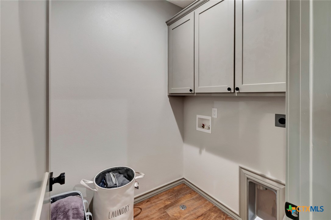 305 Turkey Lane Victoria, TX 77905 - Photo 29 of 35 a view of storage and utility room with racks on the wall
