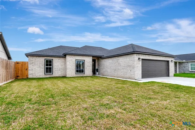 a house view with a garden space