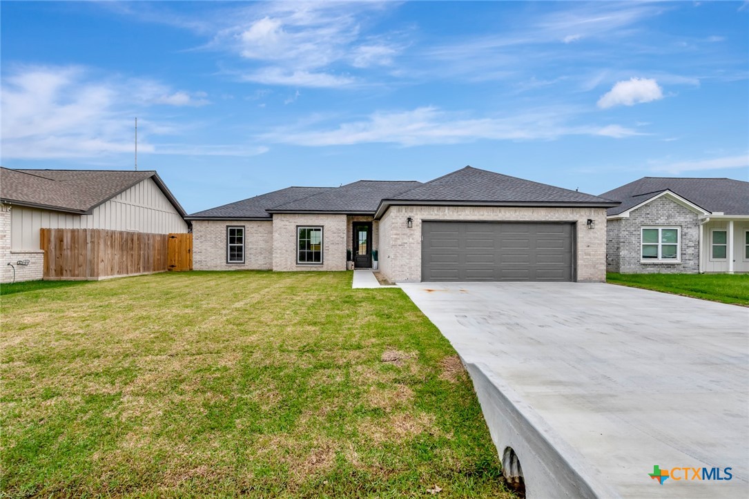 305 Turkey Lane Victoria, TX 77905 - Photo 34 of 35 a front view of a house with a garden and yard