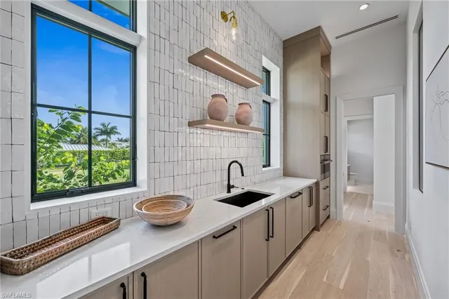 a bathroom with a sink and a window