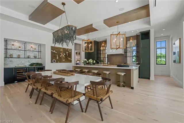 a kitchen with a table and chairs in it