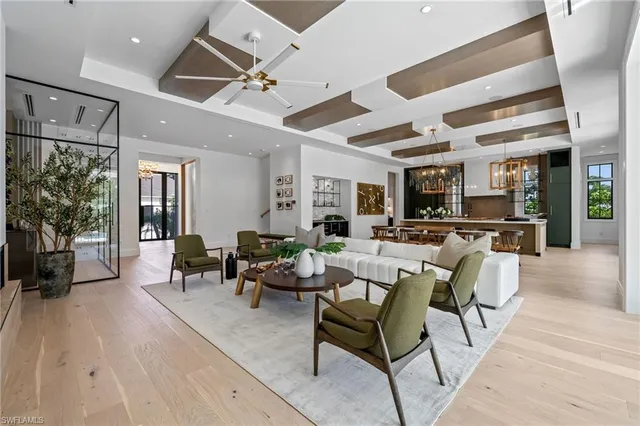 a living room with lots of furniture and white walls