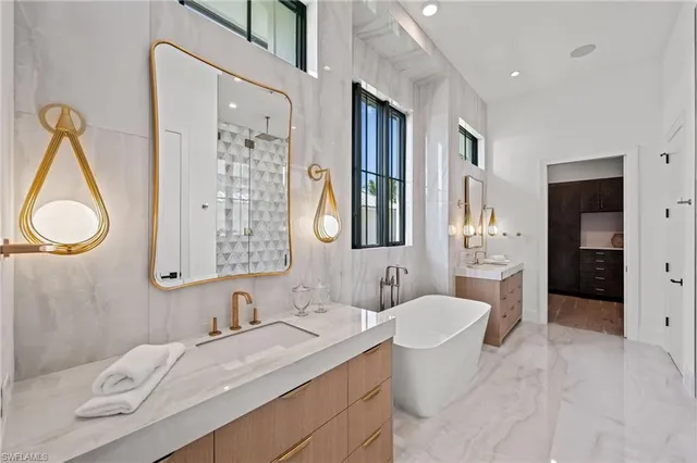 a bathroom with a granite countertop sink mirror and a shower