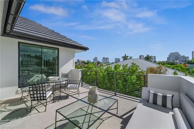 a view of a patio with a table and chairs