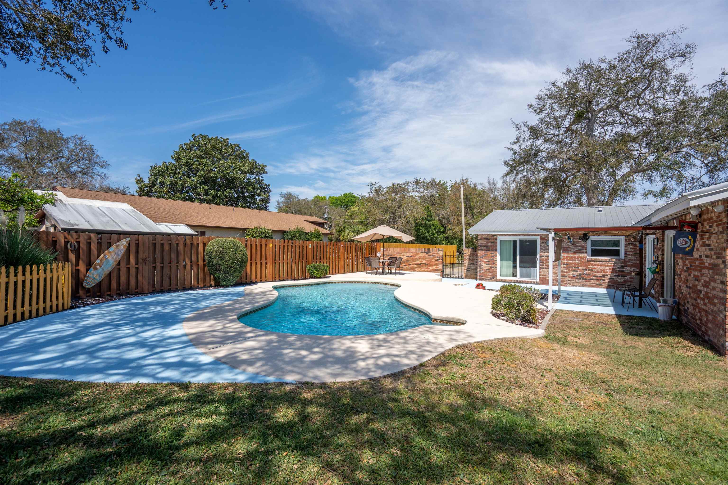 702 Queen Road St. Augustine, FL 32086 - Photo 11 of 71 a view of a house with backyard and sitting area