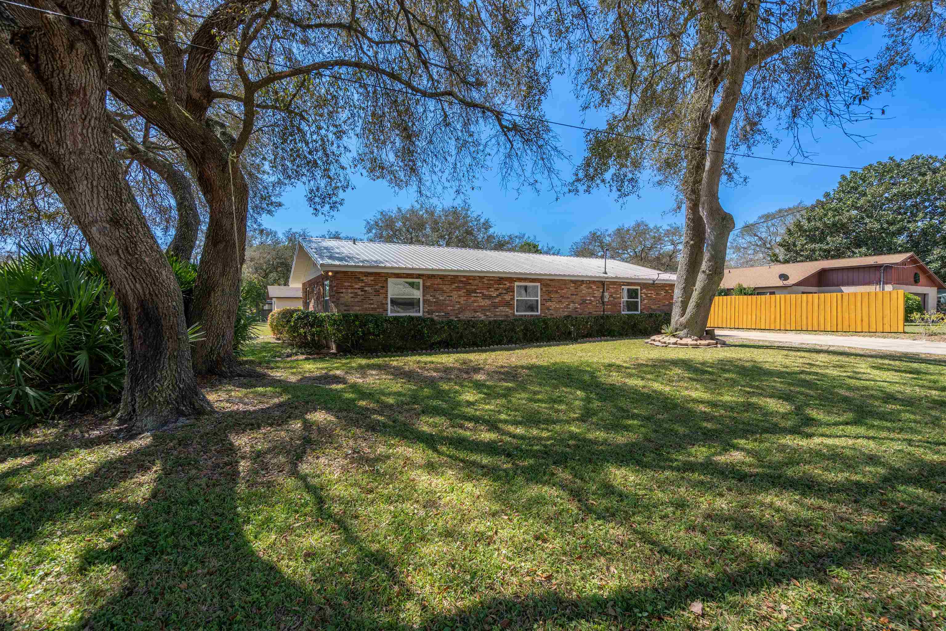 702 Queen Road St. Augustine, FL 32086 - Photo 26 of 71 a view of a house with a yard