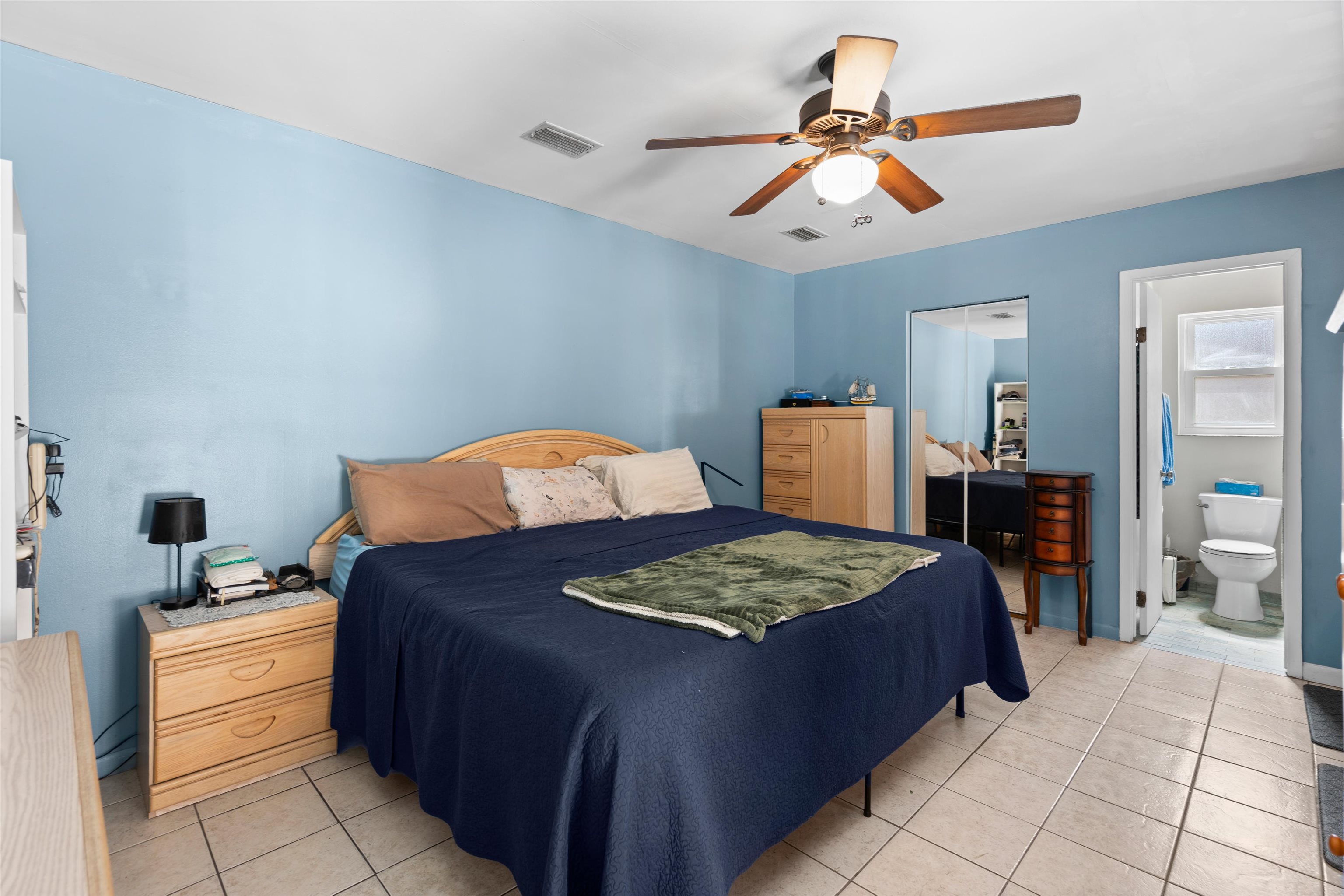 702 Queen Road St. Augustine, FL 32086 - Photo 37 of 71 a bedroom with a bed and dresser