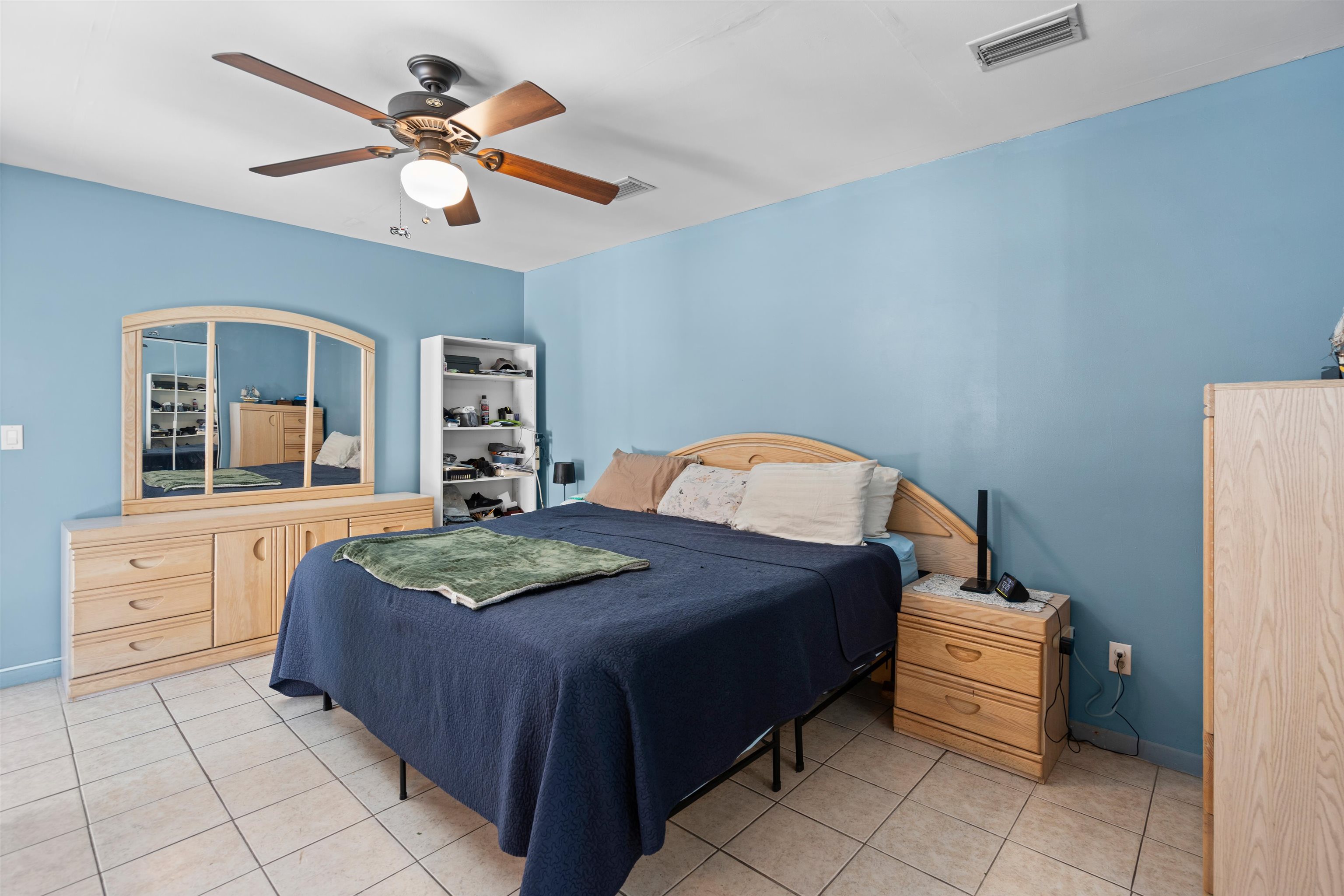 702 Queen Road St. Augustine, FL 32086 - Photo 38 of 71 a bedroom with a bed and ceiling fan