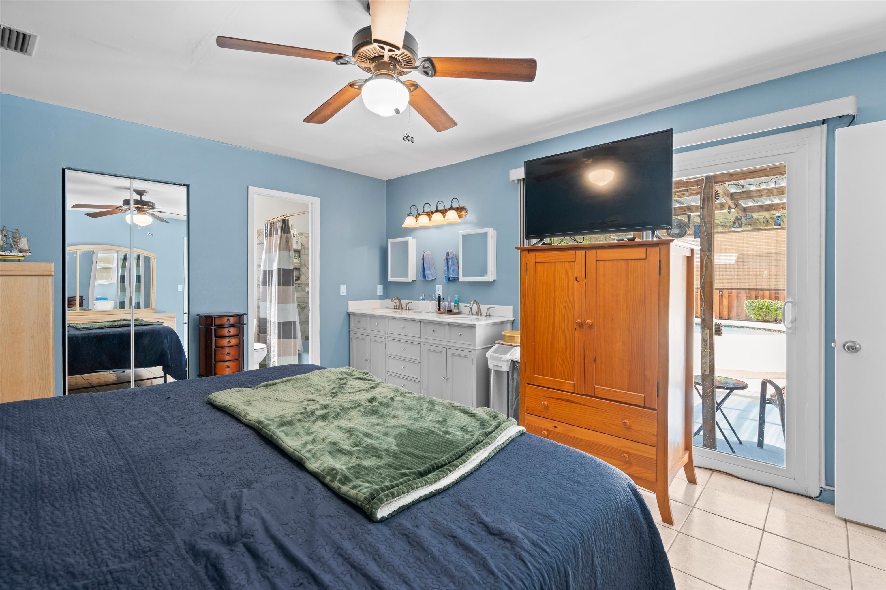 702 Queen Road St. Augustine, FL 32086 - Photo 39 of 71 a bedroom with a bed and a flat screen tv