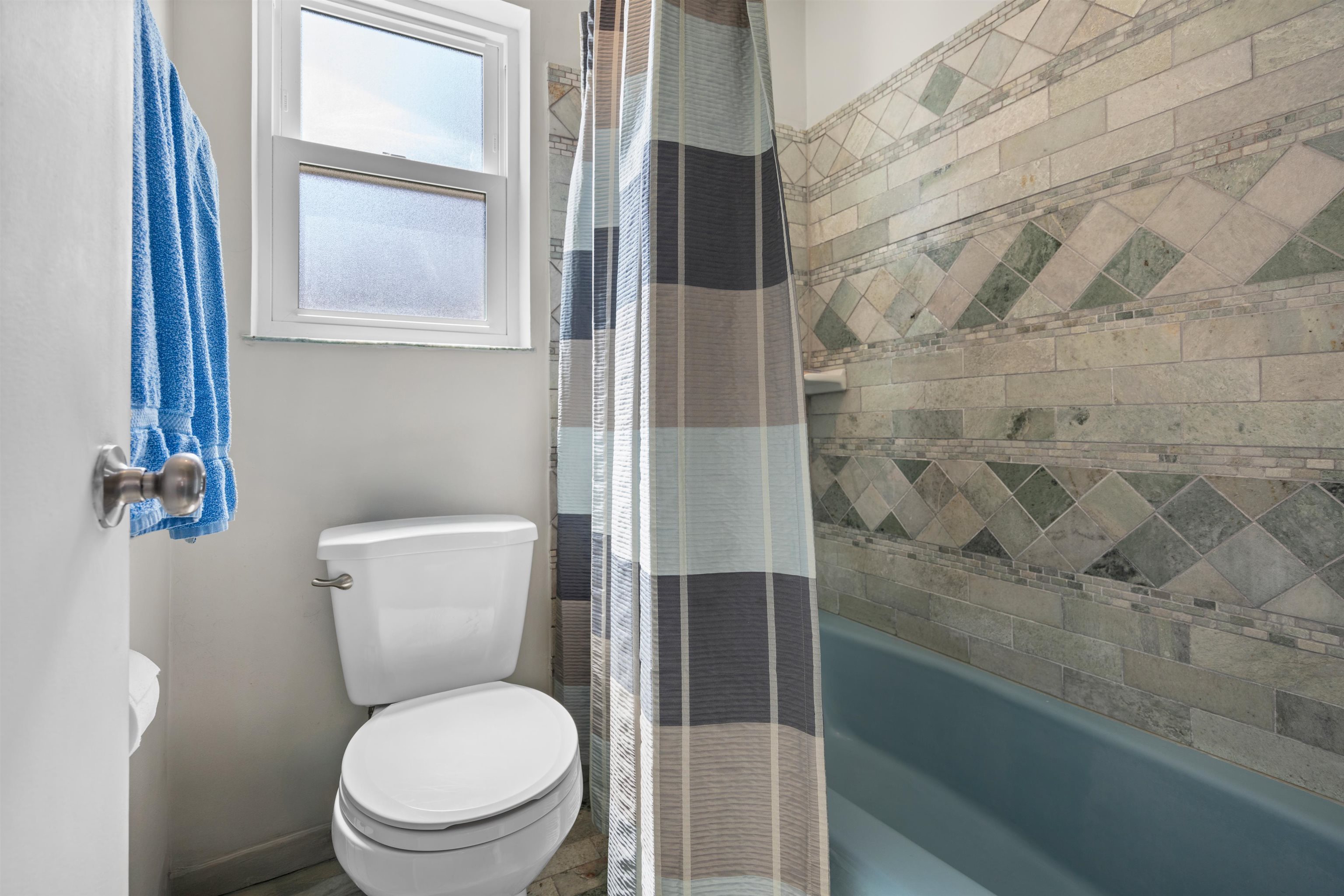 702 Queen Road St. Augustine, FL 32086 - Photo 40 of 71 a white toilet sitting next to a shower