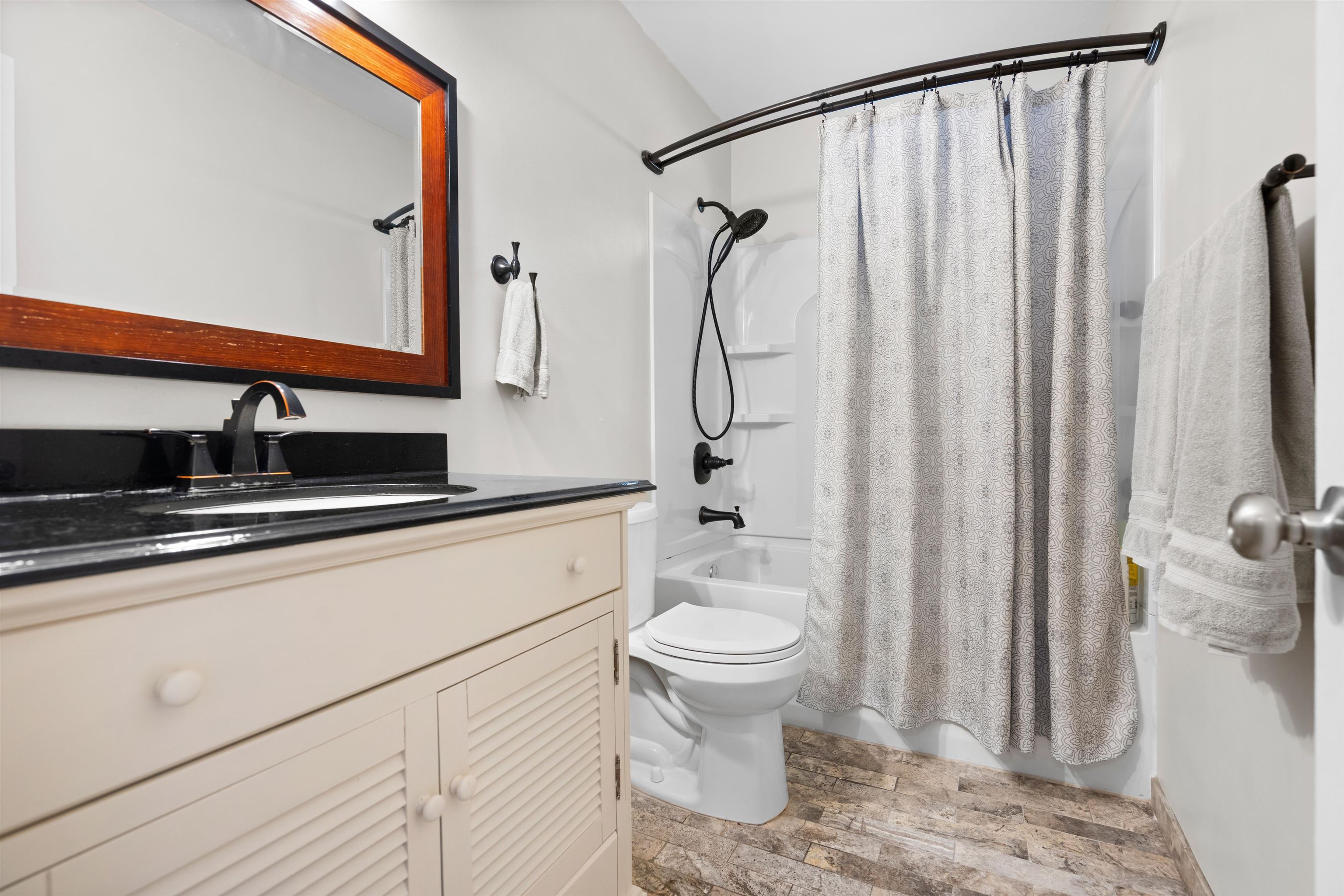 702 Queen Road St. Augustine, FL 32086 - Photo 45 of 71 a bathroom with a sink a toilet and shower