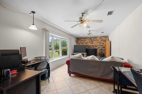 a view of a balcony with wooden floor and lake view