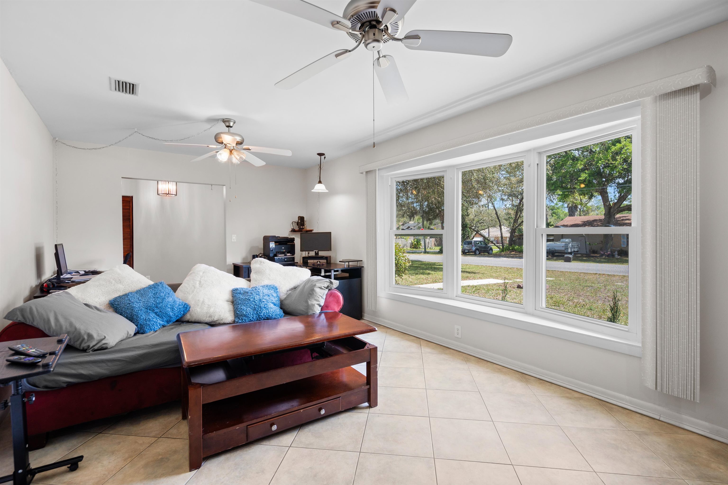 702 Queen Road St. Augustine, FL 32086 - Photo 47 of 71 a living room with furniture and a large window