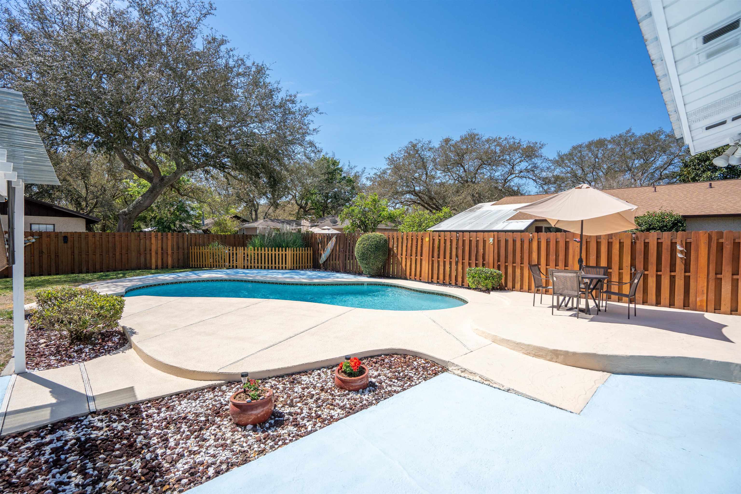 702 Queen Road St. Augustine, FL 32086 - Photo 5 of 71 a view of a backyard with a fountain