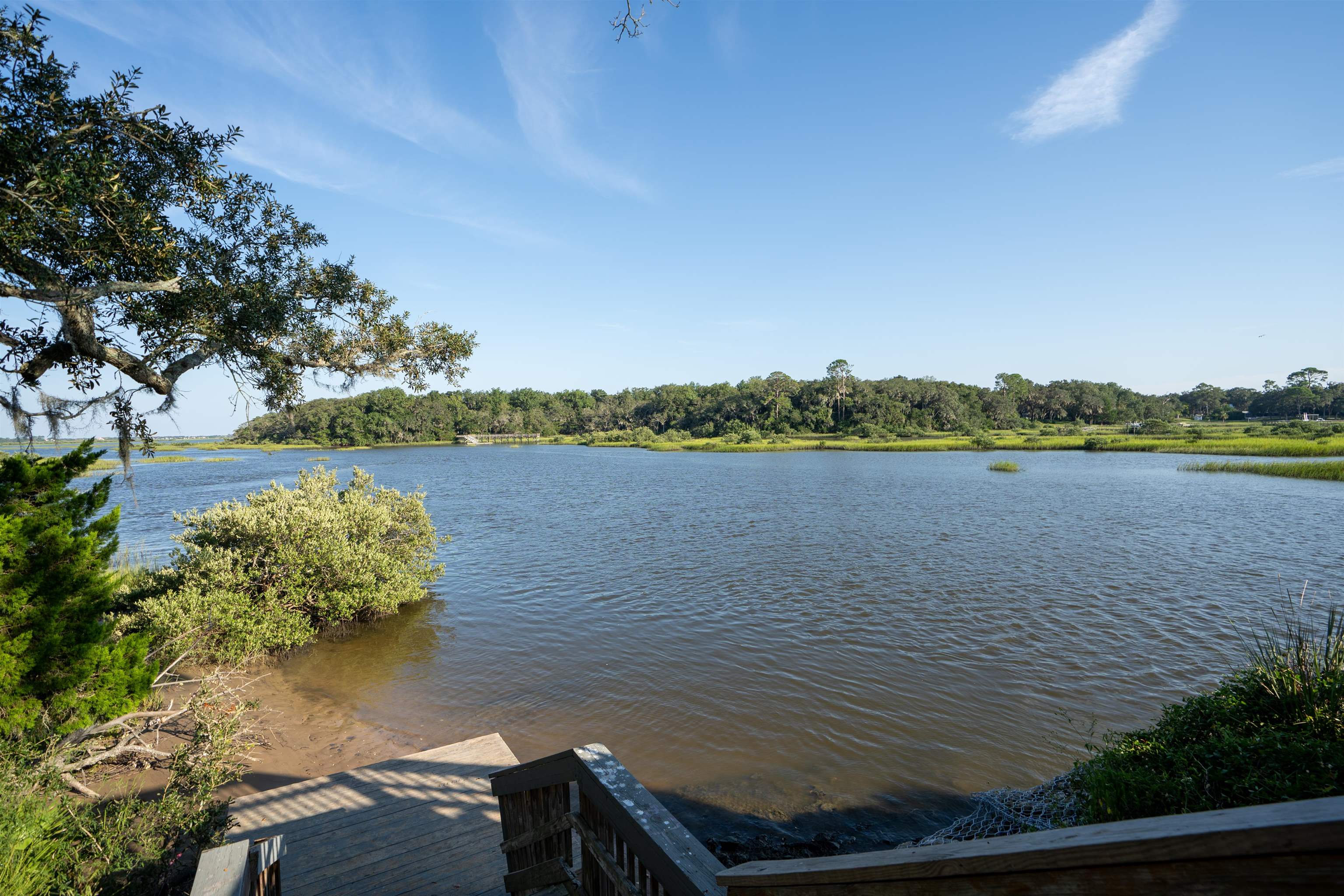 702 Queen Road St. Augustine, FL 32086 - Photo 52 of 71 a view of a lake with houses in the back