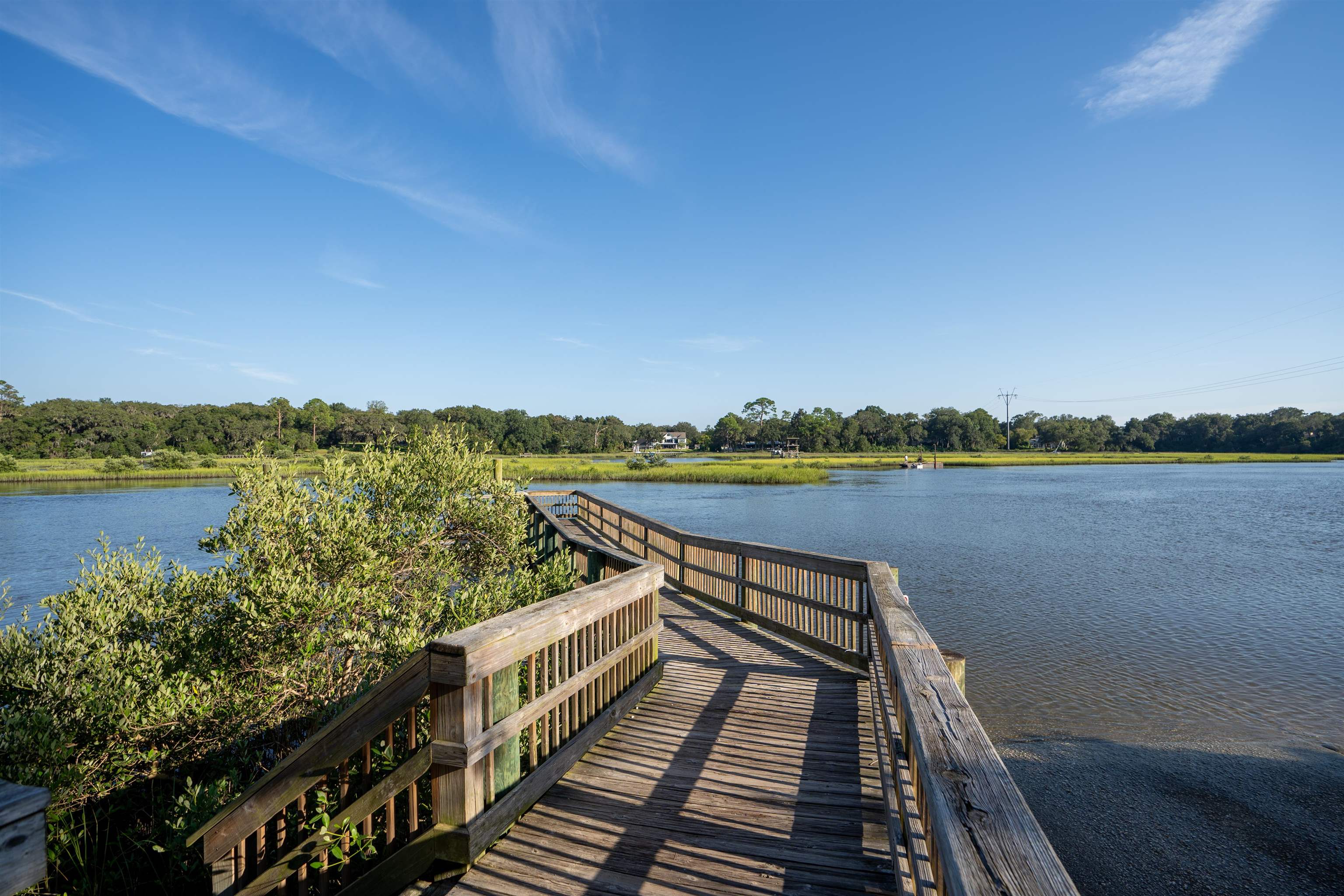 702 Queen Road St. Augustine, FL 32086 - Photo 58 of 71 a view of a lake with a deck