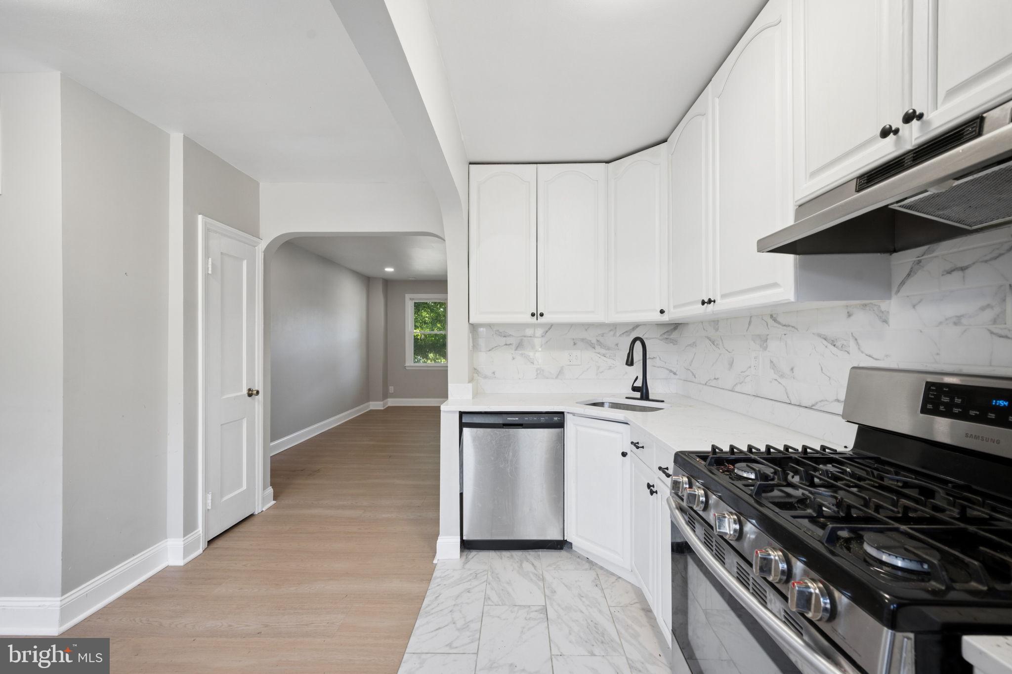 3548 Benzinger Road Baltimore, MD 21229 - Photo 12 of 40 a kitchen with stainless steel appliances granite countertop a stove and a sink