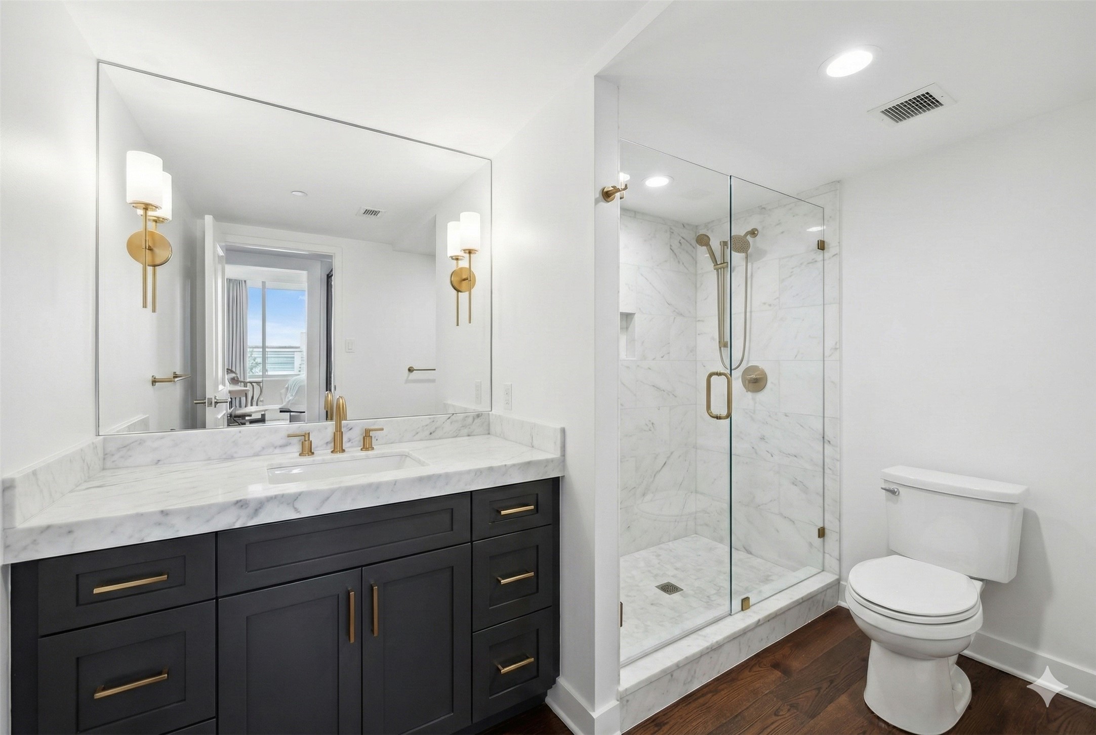 1111 Caroline Street, Unit 2908 Houston, TX 77010 - Photo 14 of 50 a bathroom with a double vanity sink toilet and shower