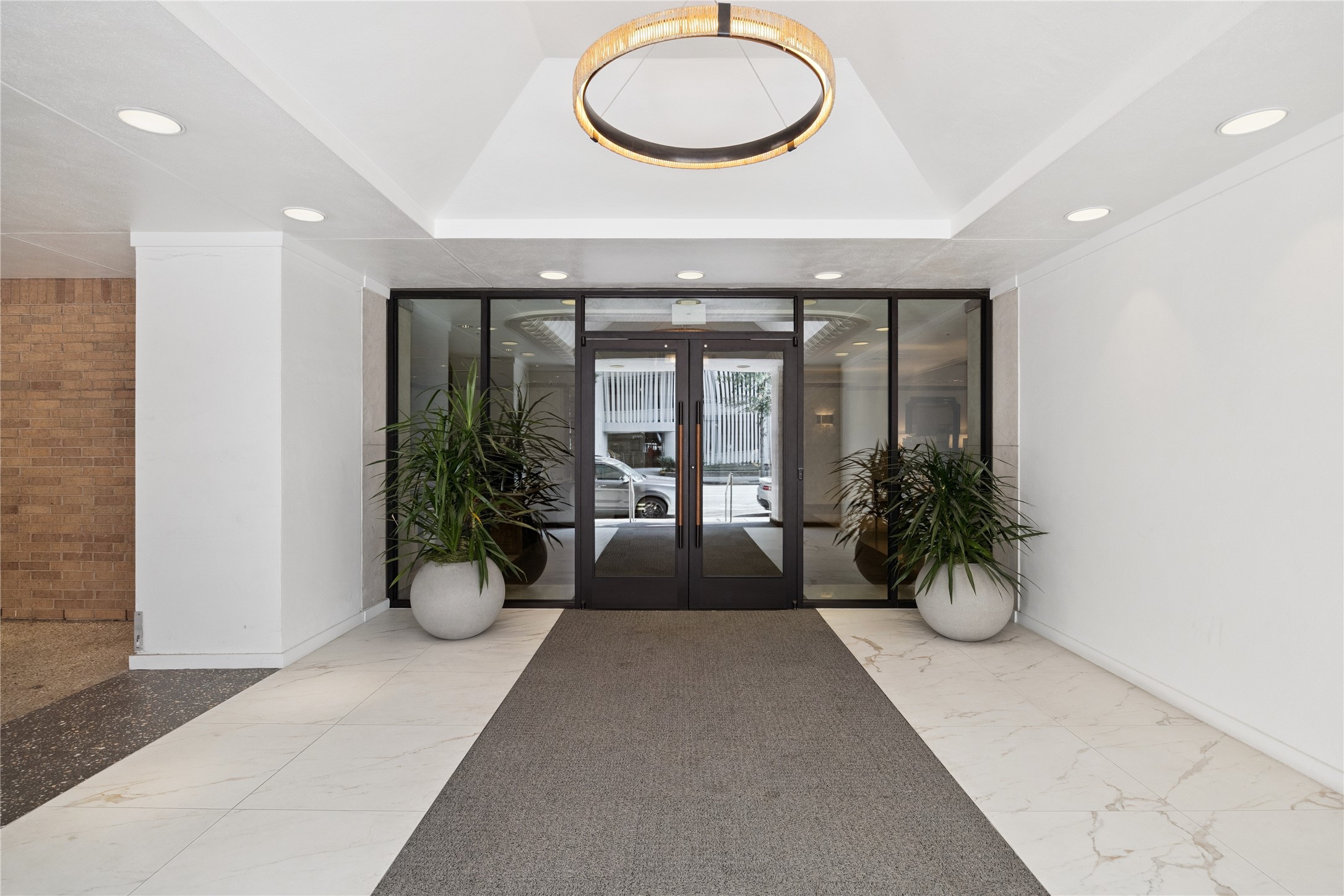 1111 Caroline Street, Unit 2908 Houston, TX 77010 - Photo 16 of 50 The dedicated entrance for Four Seasons residents has been thoughtfully remodeled with clean finishes, contemporary lighting, and secure access. This refreshed lobby sets the tone for the elevated lifestyle that awaits upstairs.