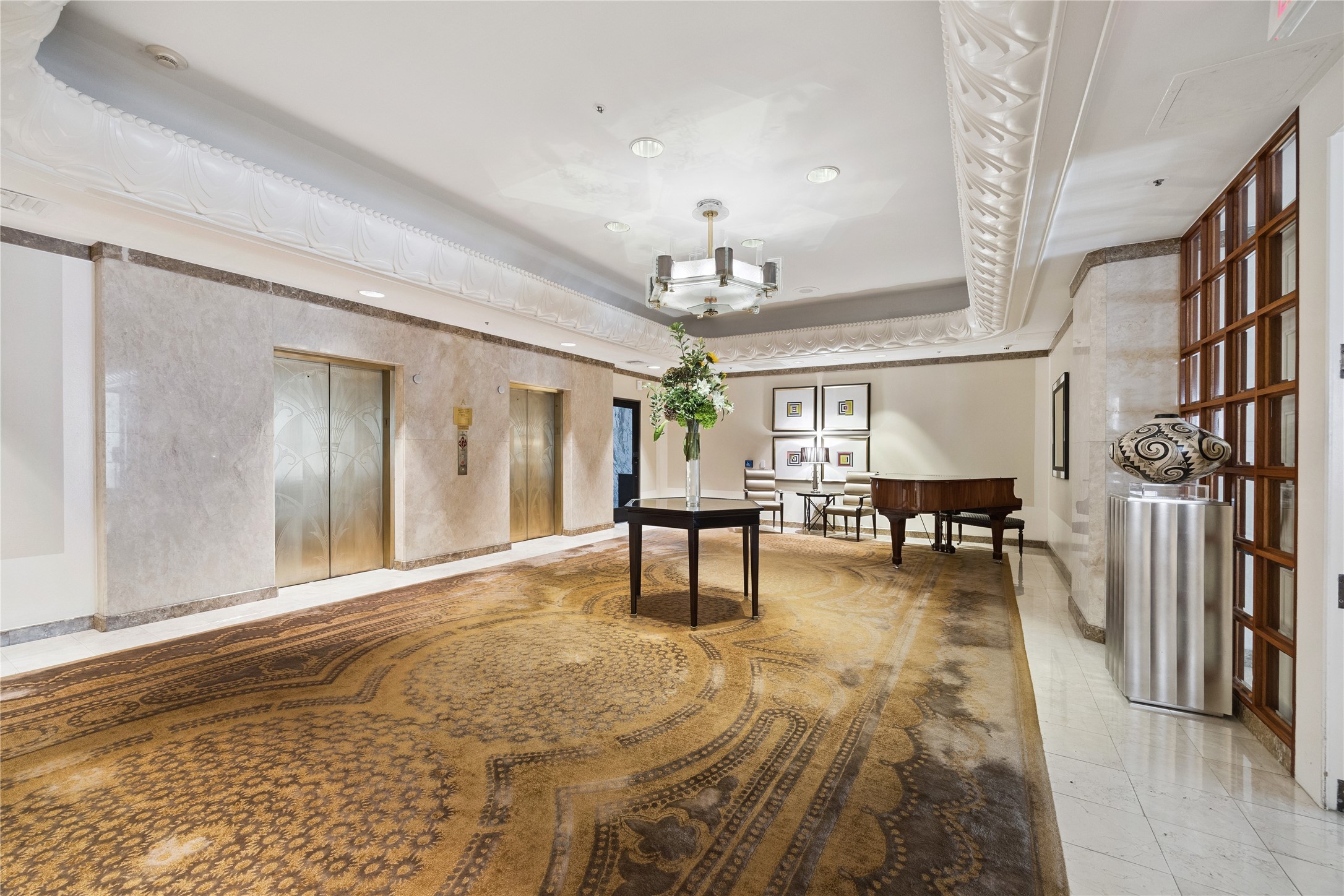 1111 Caroline Street, Unit 2908 Houston, TX 77010 - Photo 19 of 50 a living room with furniture and a chandelier