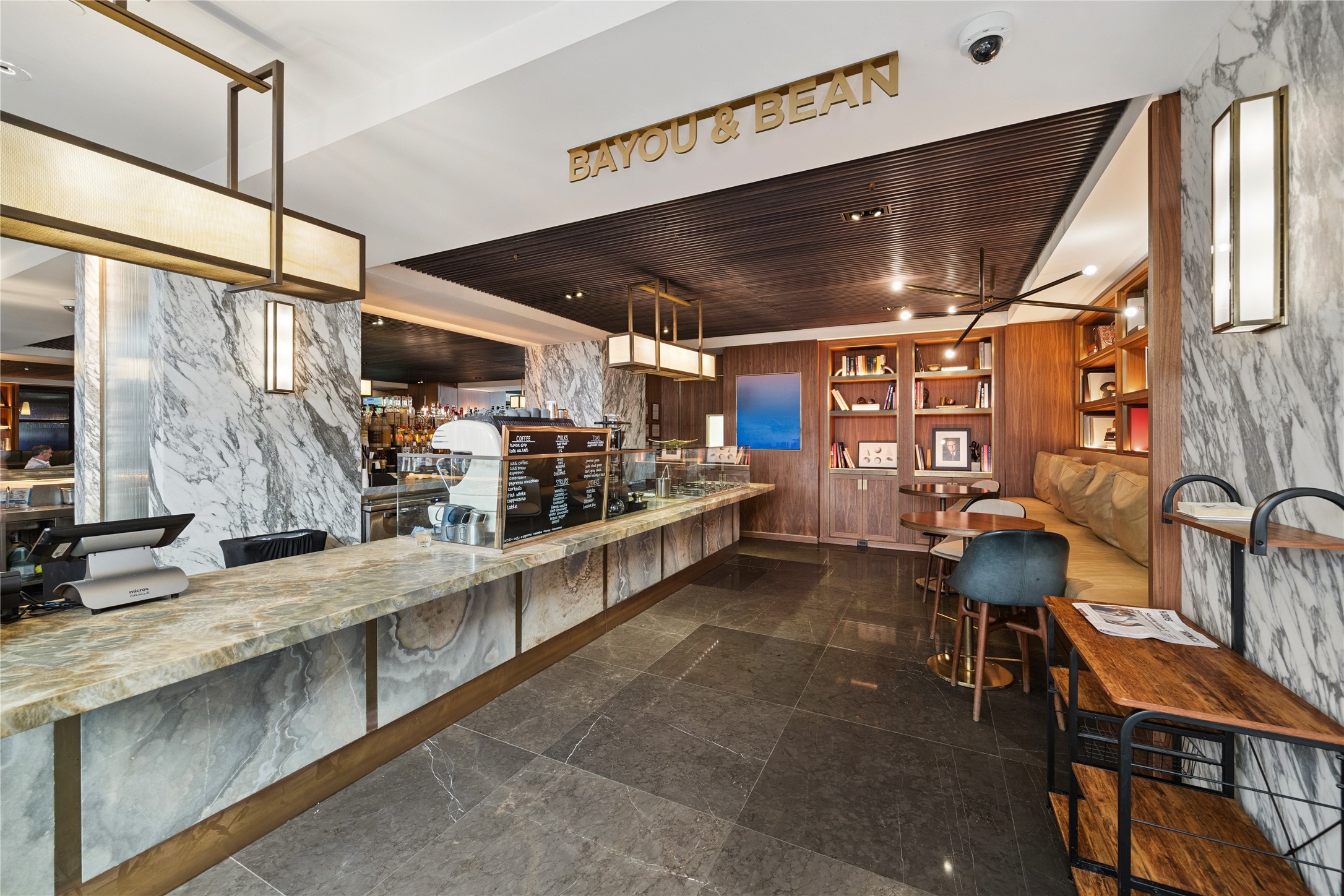 1111 Caroline Street, Unit 2908 Houston, TX 77010 - Photo 24 of 50 Bayou & Bean offers residents a convenient spot for specialty coffee, light bites, and casual meetings. With its inviting design and connection to the hotel, it brings a relaxed neighborhood feel right into the building.