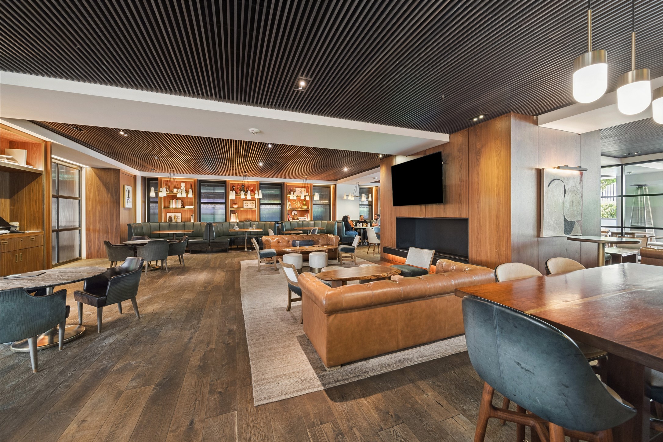 1111 Caroline Street, Unit 2908 Houston, TX 77010 - Photo 27 of 50 a living room with fireplace furniture and a flat screen tv