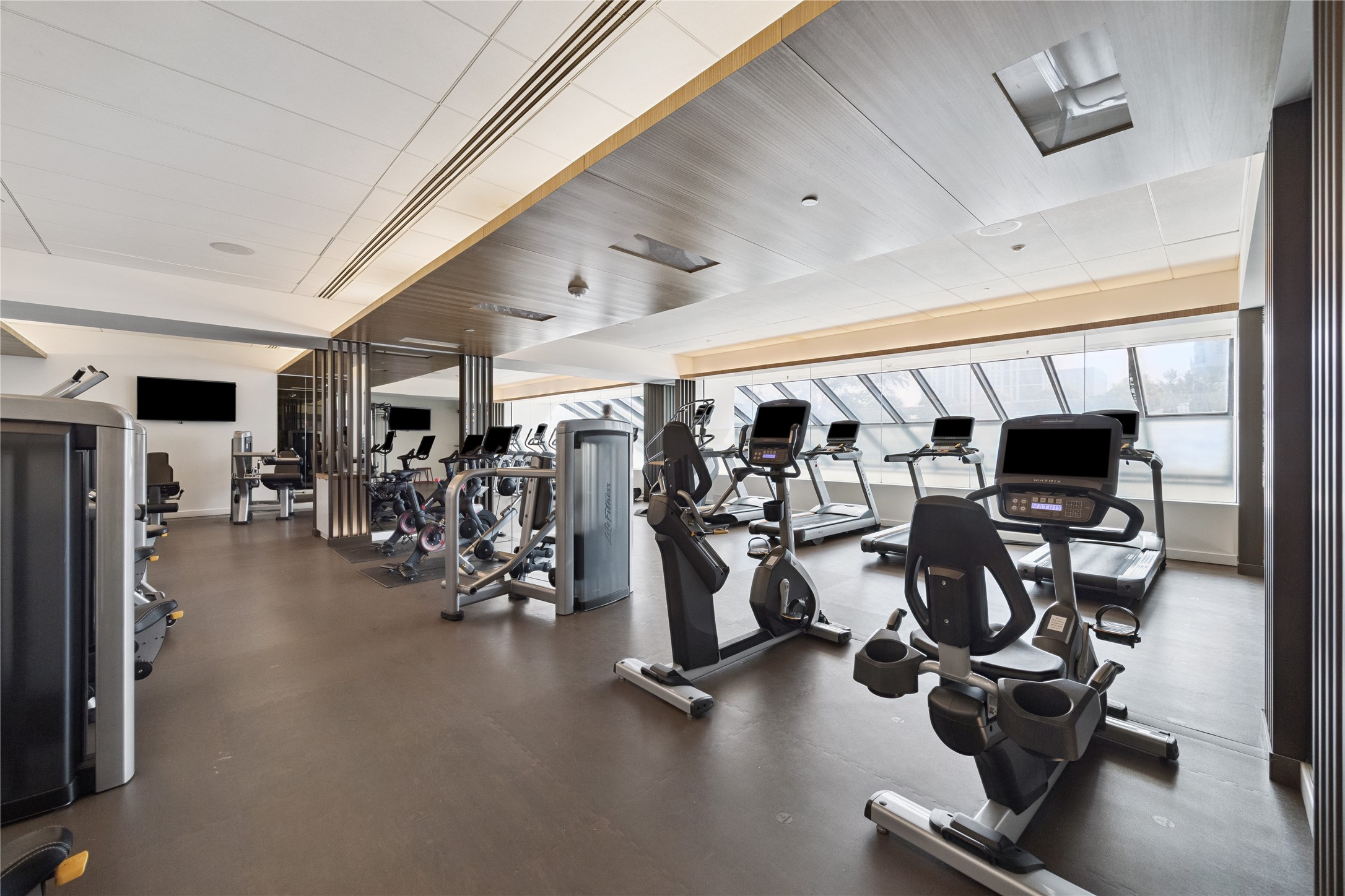1111 Caroline Street, Unit 2908 Houston, TX 77010 - Photo 28 of 50 The gym features a full range of cardio and strength training machines in a bright, spacious setting. Open around the clock, it provides residents with the convenience of professional wellness facilities.