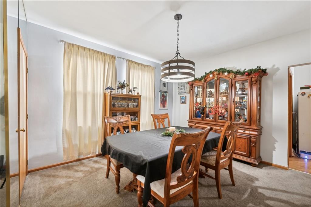 851 Hober Avenue McKees Rocks, PA 15136 - Photo 11 of 32 a view of a dining room with furniture window and wooden floor