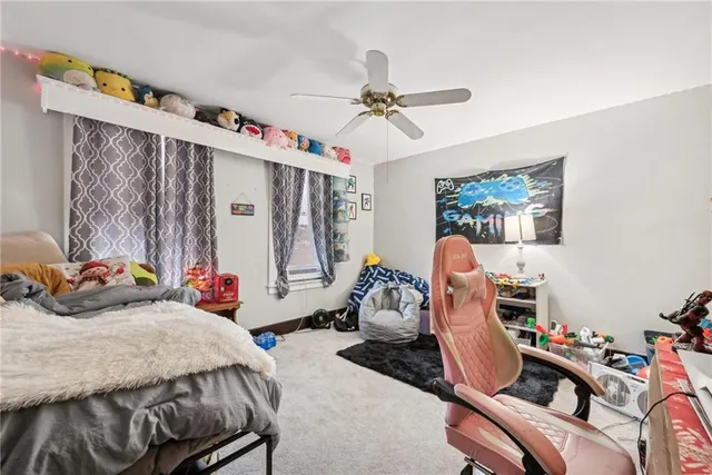 a bedroom with bed and a window