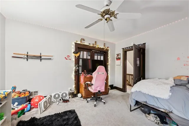 a bed room with a bed and a chandelier