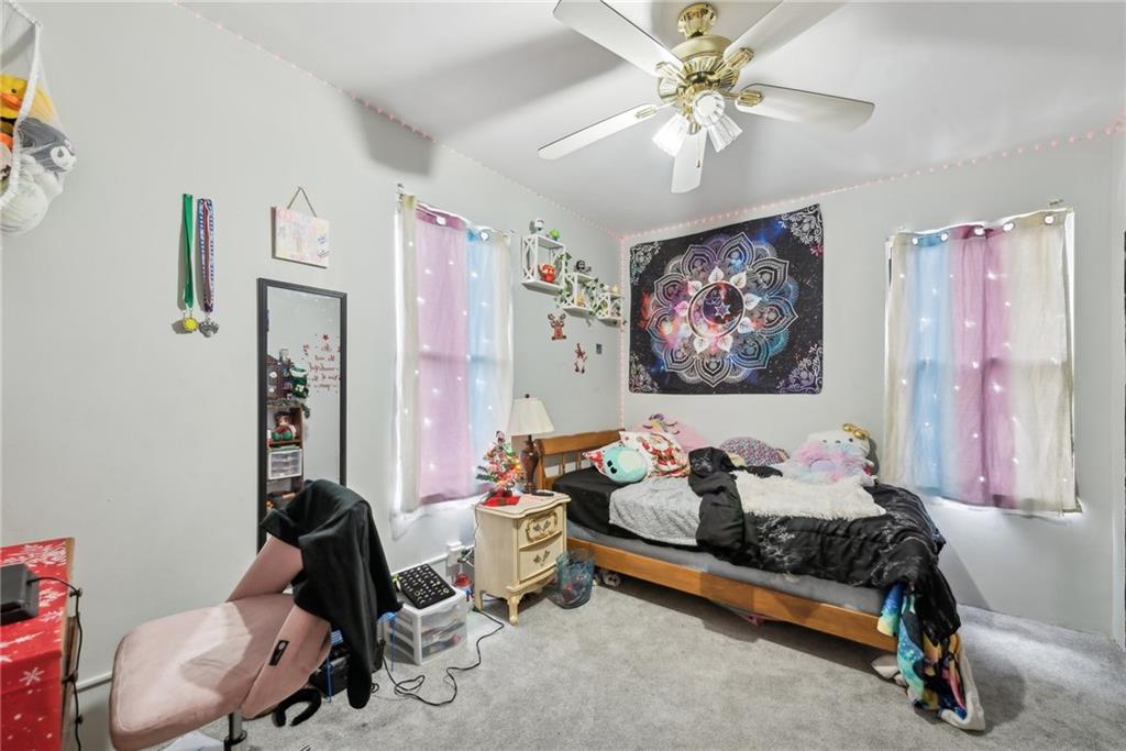 851 Hober Avenue McKees Rocks, PA 15136 - Photo 23 of 32 a living room with furniture and a chandelier