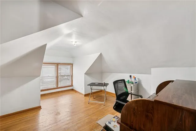 a workspace with furniture and wooden floor