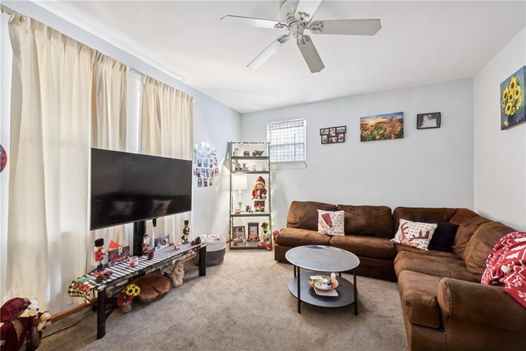 851 Hober Avenue McKees Rocks, PA 15136 - Photo 6 of 32 a living room with furniture and a flat screen tv